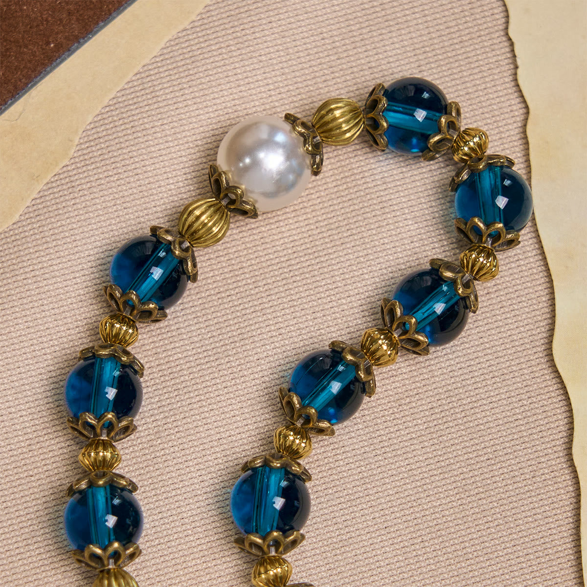 Spiritual Blue Gloss Bead Bracelets Featuring Sacred Brass Crucifix - The Heavenly